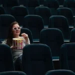 Woman watching movie at the best Cinema in Murray Bridge